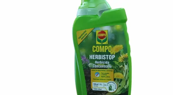 Bouteille verte de COMPO Herbistop, un désherbant concentré à base d'acide pélargonique pour jardins.