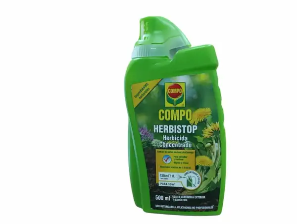 Bouteille verte de COMPO Herbistop, un désherbant concentré à base d'acide pélargonique pour jardins.